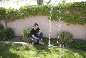 one of our Baytown sprinkler repair techs is fixing a broken head