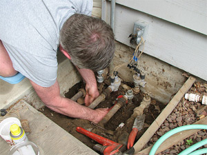 one of our techs is fixing an irrigation valve